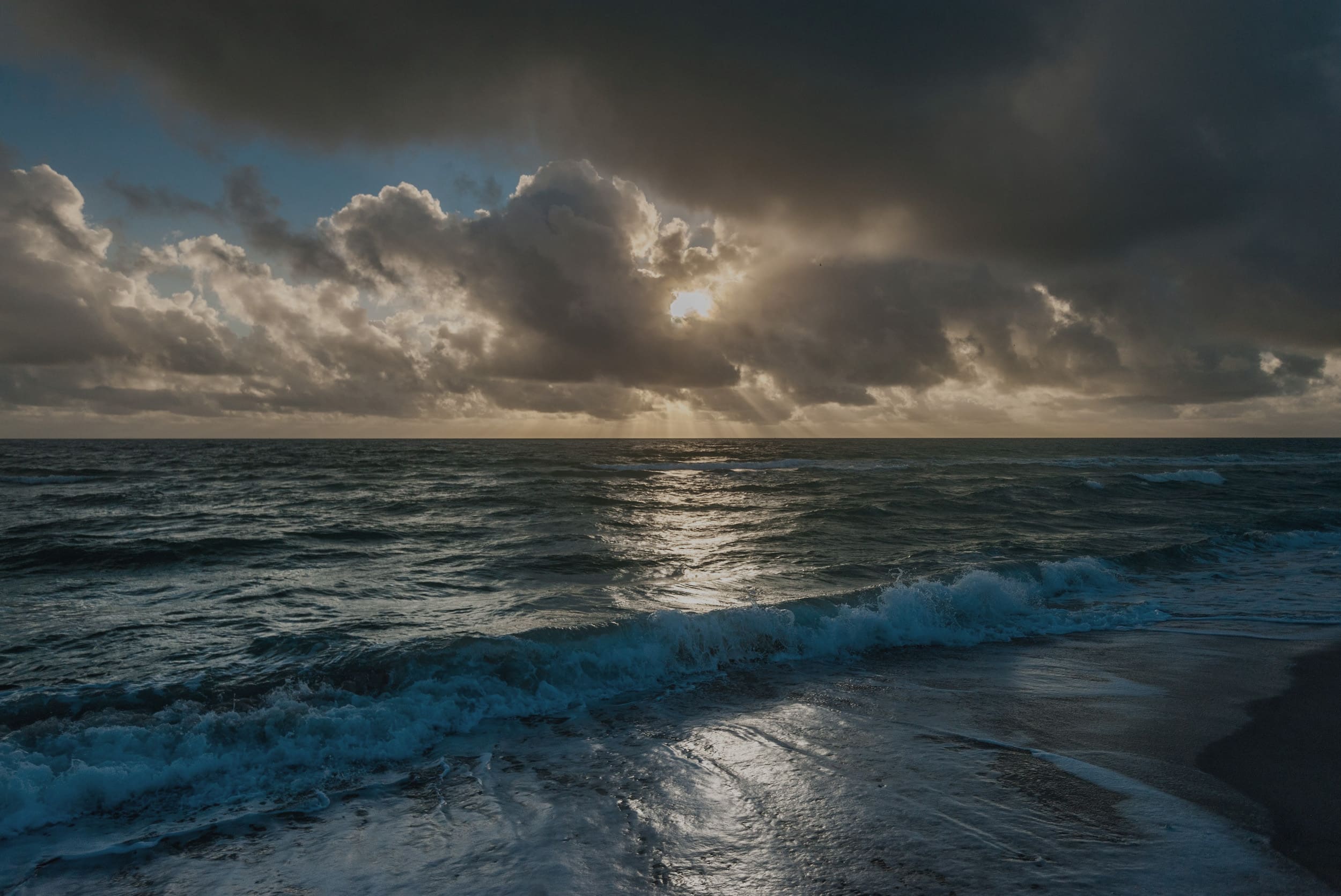 Moody ocean coastline representing estate liquidity planning for closely held business owners